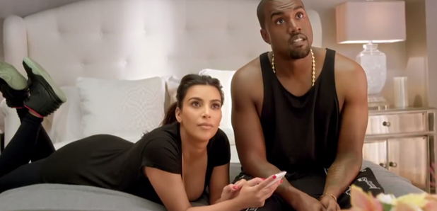 Kanye West and Kim Kardashian on bed