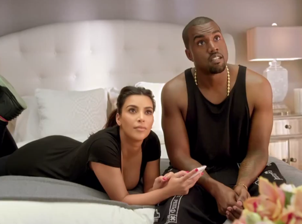 Kanye West and Kim Kardashian on bed
