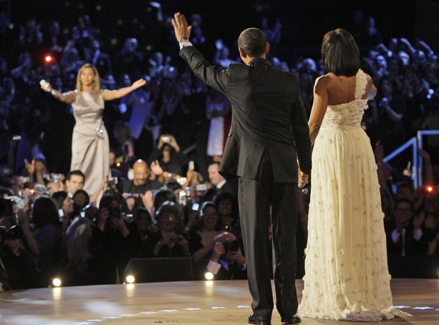 Barack Obama and Michelle Obama wave to Beyonce