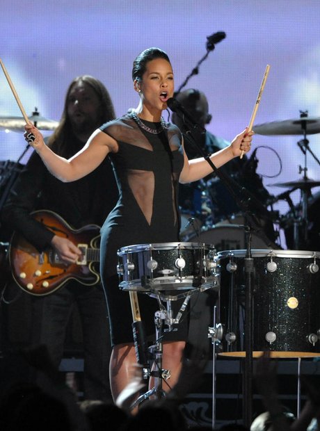 Adam Levin of Maroon 5 and Alicia Keys perform at