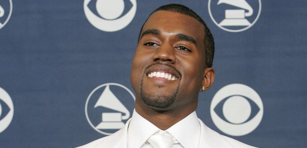 Kanye West holding Grammy Awards