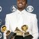Image 9: Kanye West holding Grammy Awards
