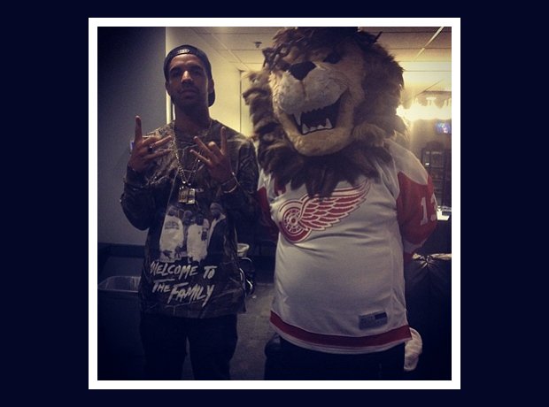Drake and a lion mascot
