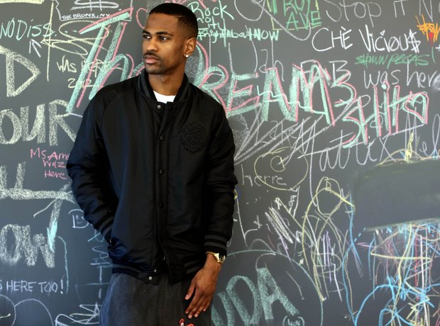 Big Sean standing in front of a chalkboard
