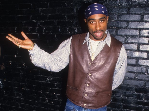 Tupac Shakur wearing leather waistcoat