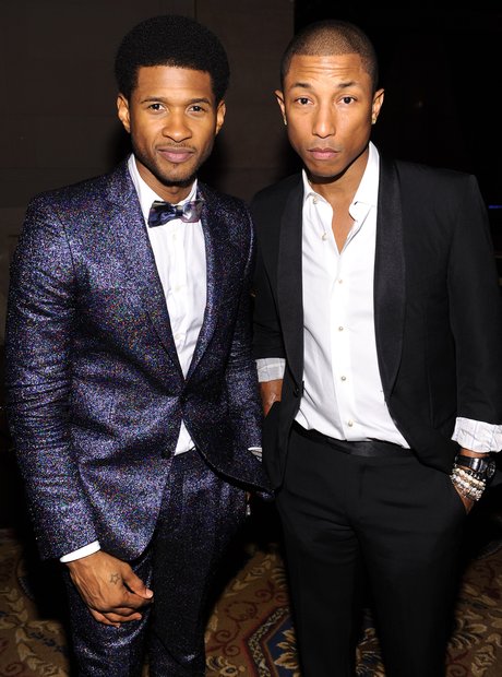 Pharrell Williams and Usher both wear color-coordinated outfits