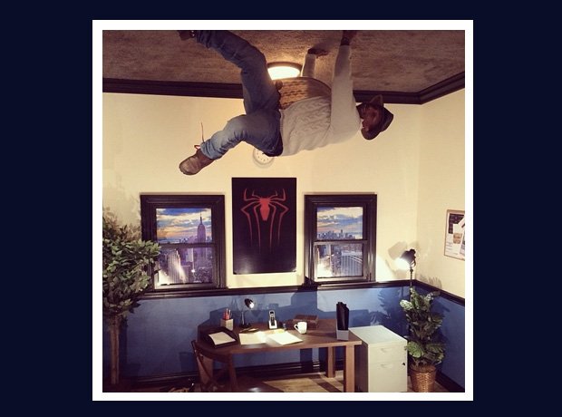 Pharrell Williams like Spider-Man on ceiling
