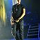 Image 1: J Cole wearing black trousers on stage the Eventim Apollo in London