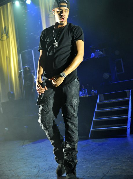 J Cole wearing black trousers on stage the Eventim Apollo in London