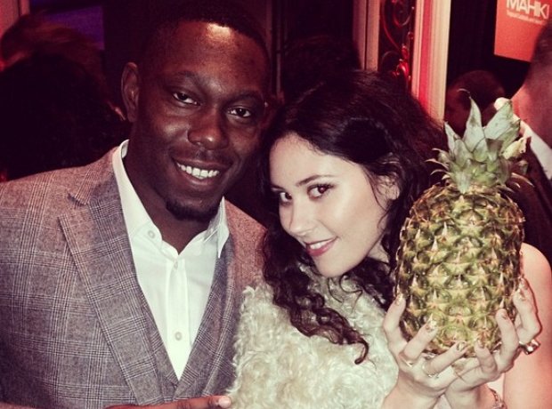 Eliza Doolittle holding a pineapple during a picture with Dizzee Rascal
