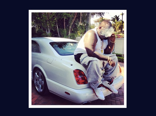 Rick Ross Instagram smoking on car