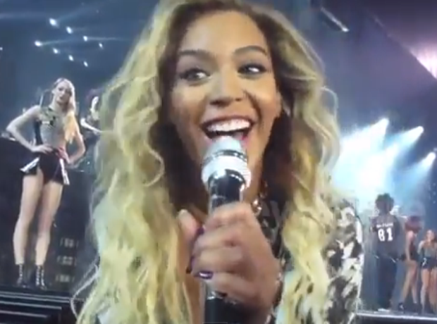Beyonce singing in a microphone