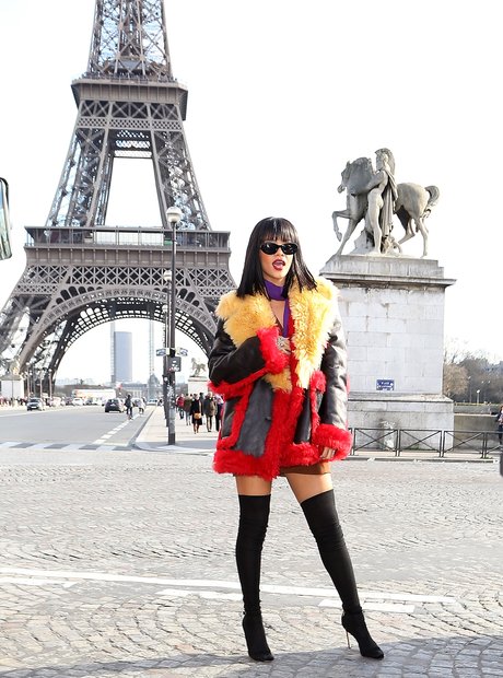 Rihanna poses by the Eiffel Tower