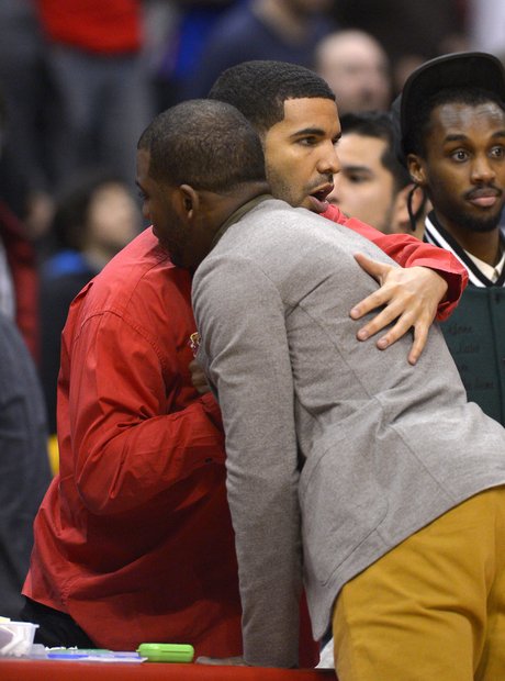 Drake hugs Los Angeles Clippers' Chris Paul