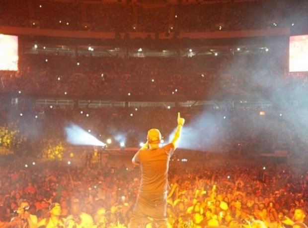 Nas performing on stage at Summer Jam