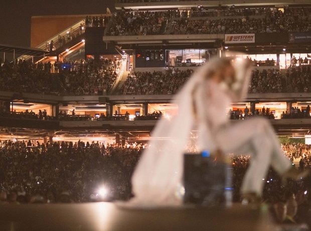 Beyonce in a white wedding dress during 'On The Run' tour