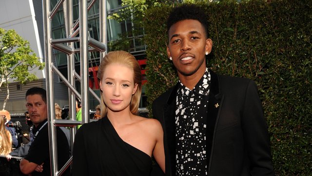 Iggy Azalea (L) and NBA player Nick Young attend T