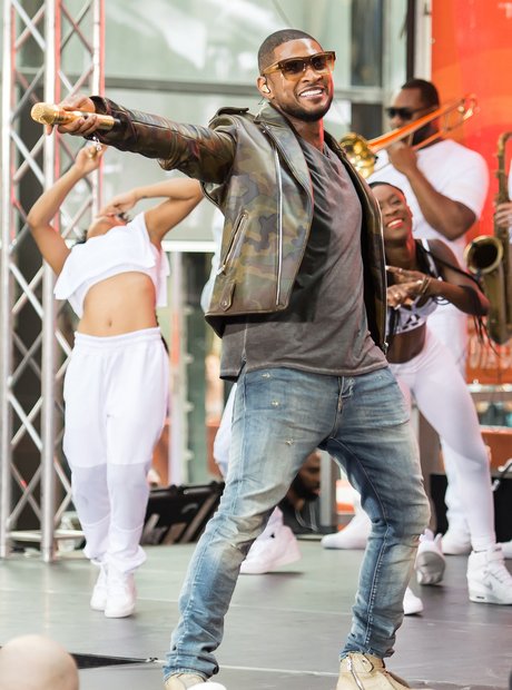 Usher performs on stage 