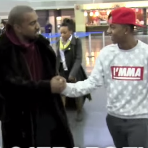 Kanye West in airport with fan