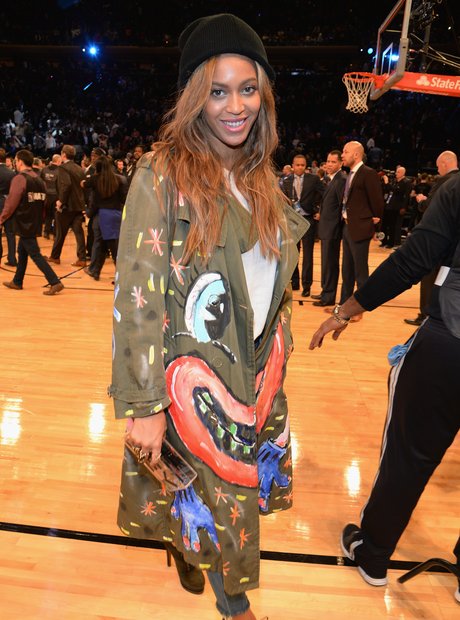 Beyonce watches the basketball 