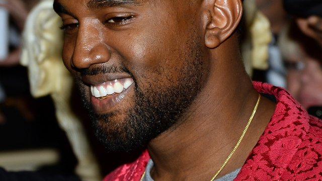 Kanye Smiling red jacket