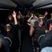 Image 1: Rihanna fans on a bus