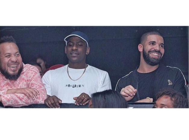 Skepta next to Drake in a club
