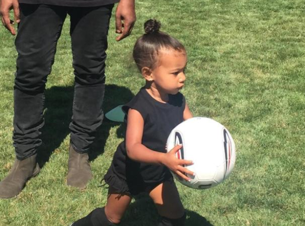 North West running with football