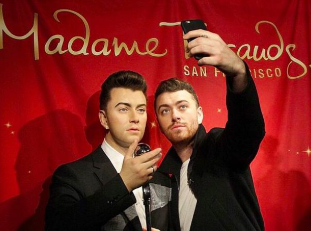 Sam Smith with his wax work at Madame Tussauds