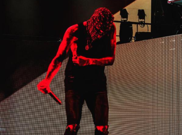 Chris Brown on stage wearing mask