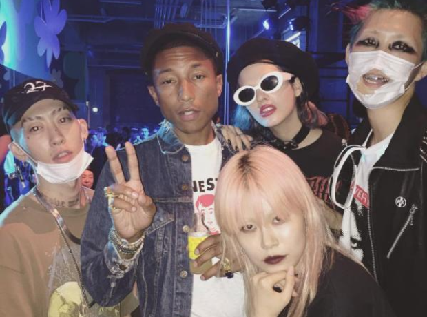 Pharrell Williams with people in Tokyo
