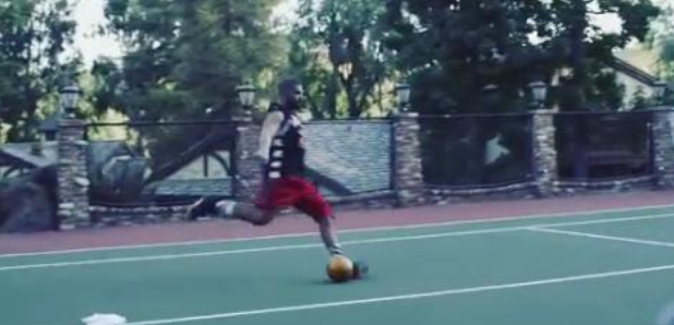 Drake kicking football