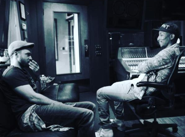 Justin Timberlake and Pharrell sitting on chairs