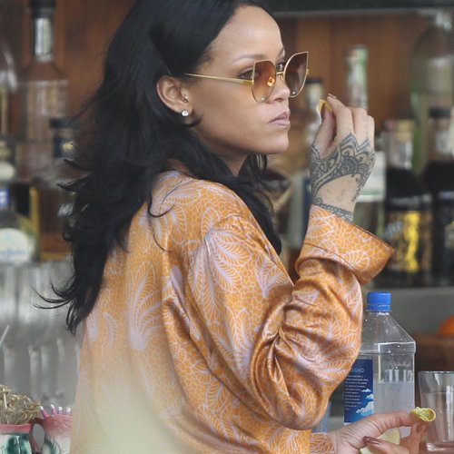 Rihanna chilling out poolside ahead of gig in Miam
