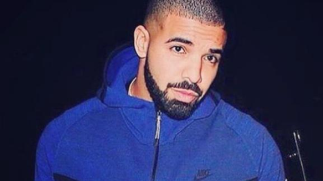 Drake wearing blue jacket