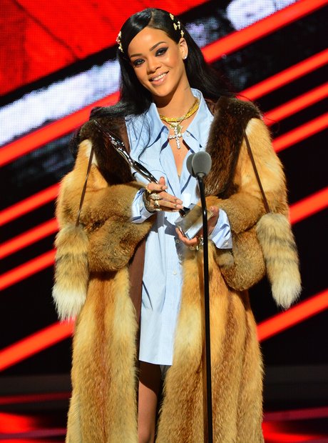 Rihanna accepting award on stage