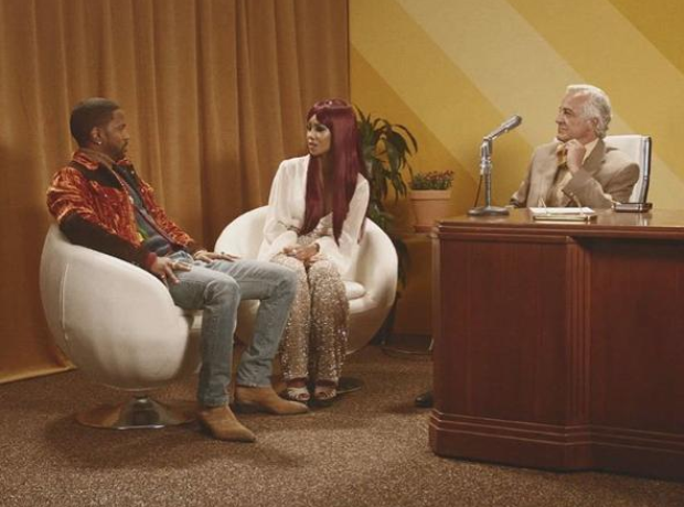 Big Sean and Jhene Aiko sat on chairs