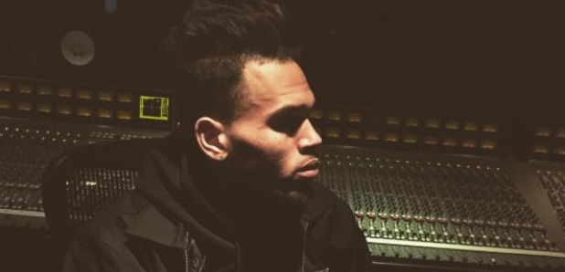 Chris Brown sitting in the studio
