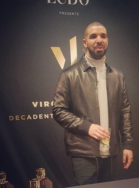 Drake holding drink