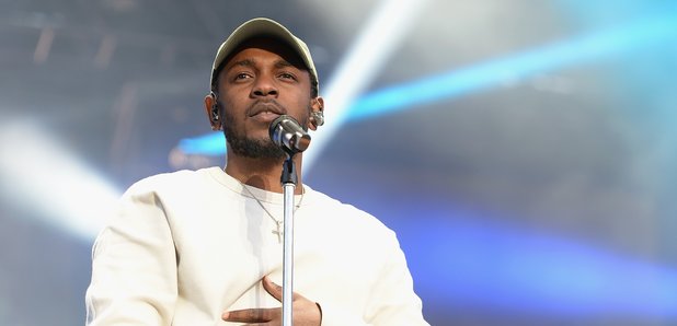 Kendrick Lamar performing on stage