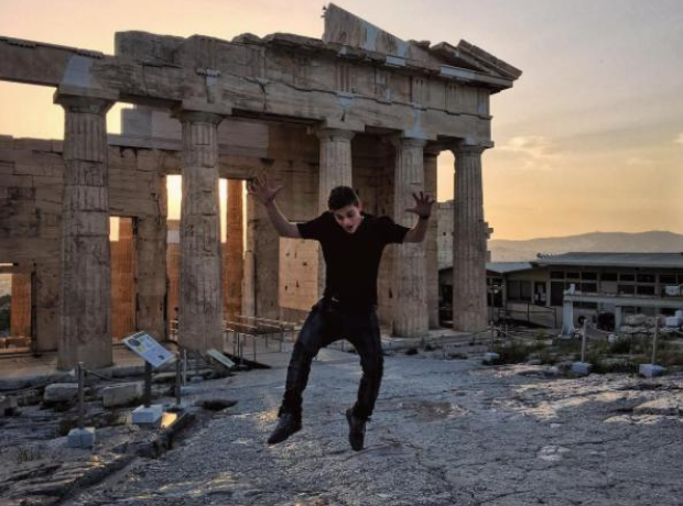 Martin Garrix jumping in front of parthenon