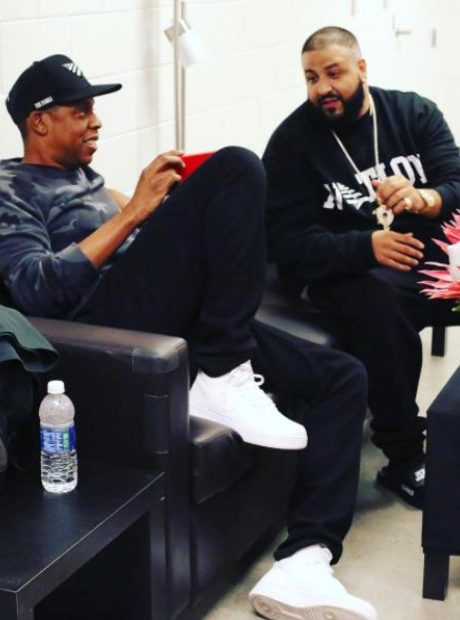 Jay Z DJ and Khaled sitting on chair