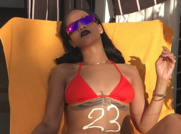 Rihanna sunbathing