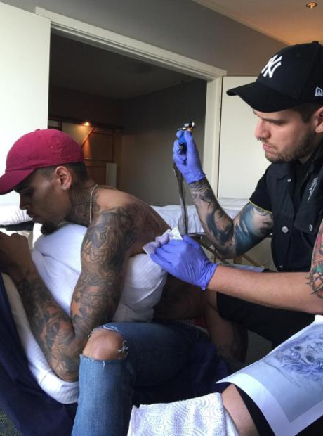 Chris Brown getting tattoo