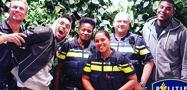 Chris Brown with police in Amsterdam 