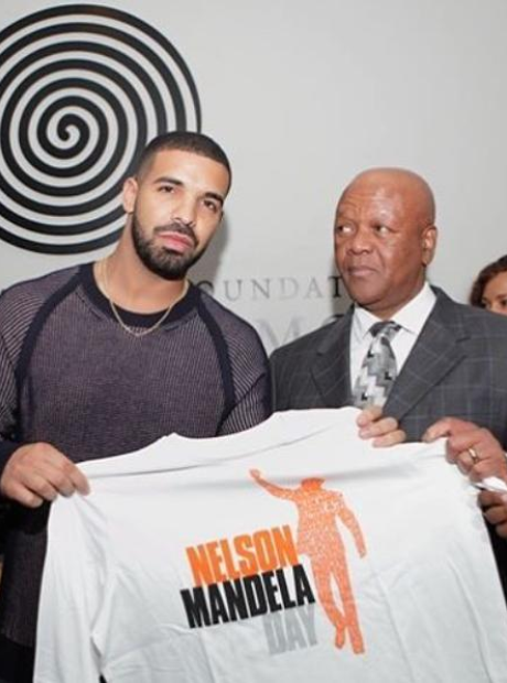 Drake holding Nelson Mandela shirt