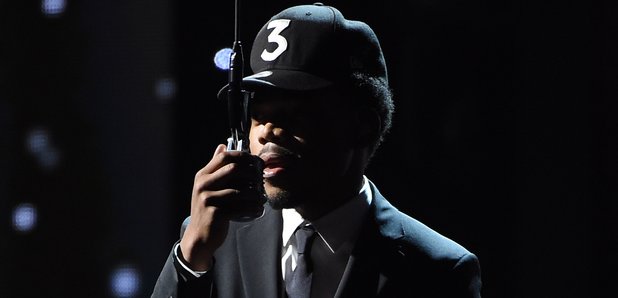 Chance The Rapper holding mic