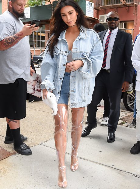 Kim Kardashian in plastic thigh high boots