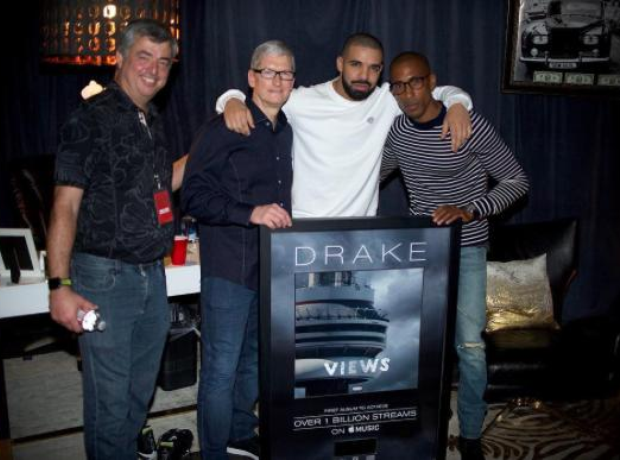 Drake holding plaque