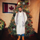 Image 3: Drake in front of a Christmas tree